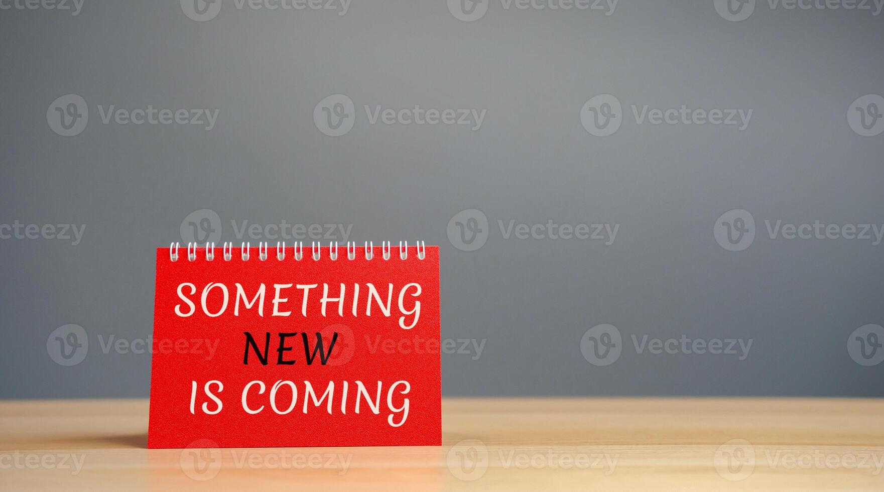 Note with the words something new is coming. Something must happen soon. Coming soon. Motivation and inspiration concept photo