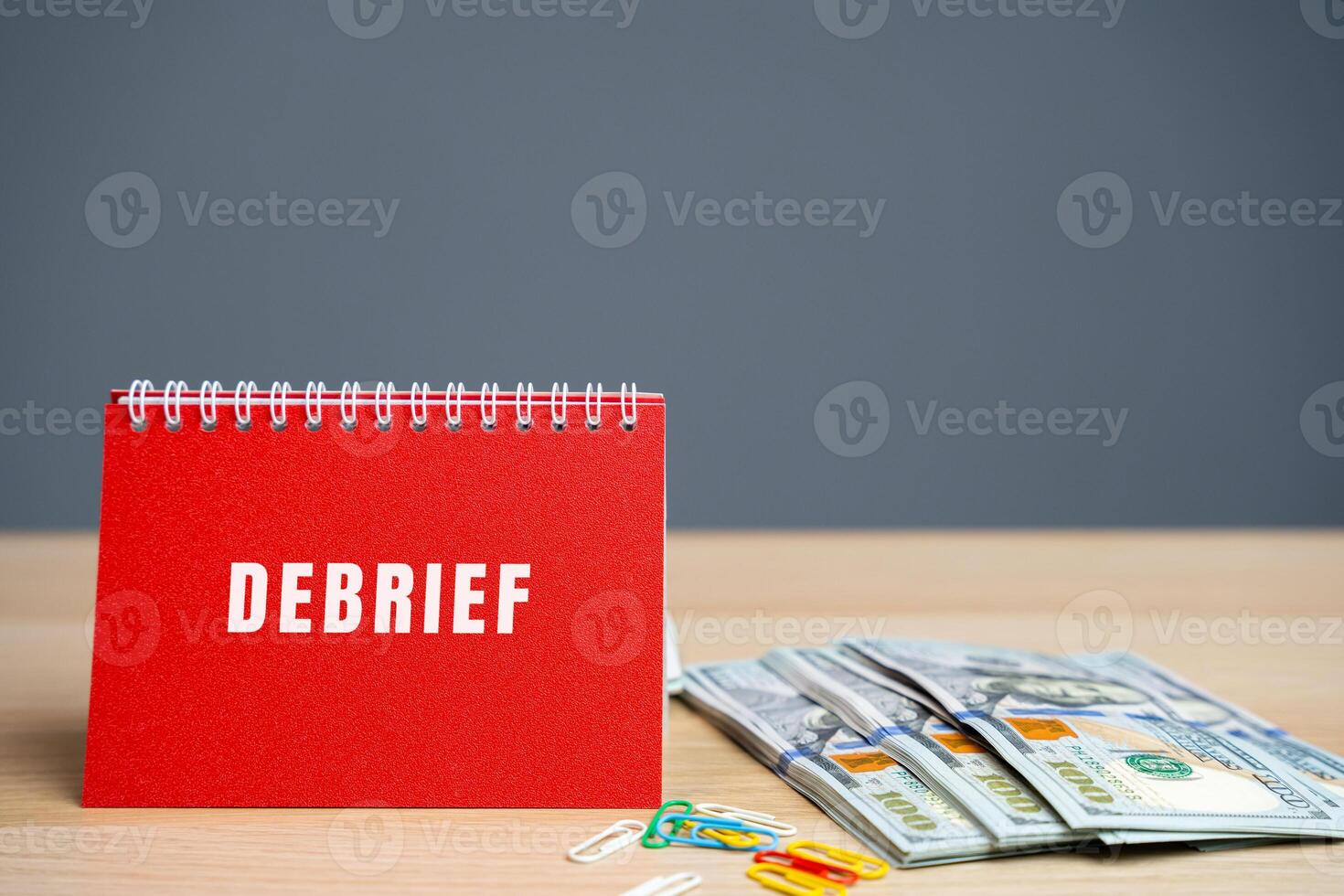 Notes debrief on a notes. Report of a mission or project and the information so obtained. Business concept. Dollars bills photo