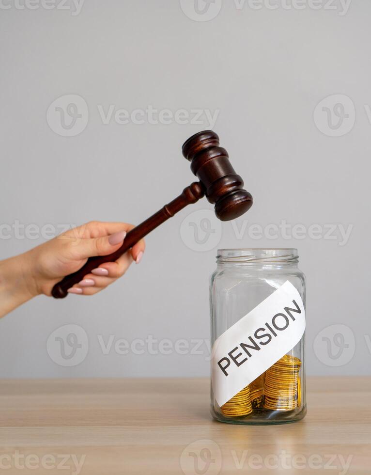 Bank of coins Pension and gavel. Legal disputes or claims involving pension benefits. Business and finance concept photo
