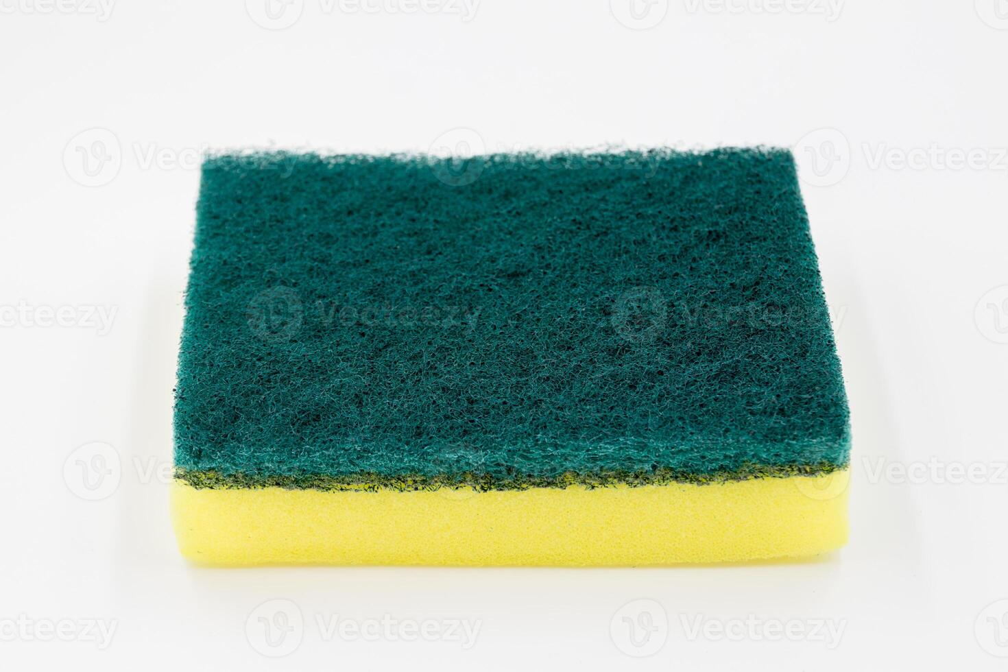 Yellow sponge for dishwashing in kitchen on white background. photo