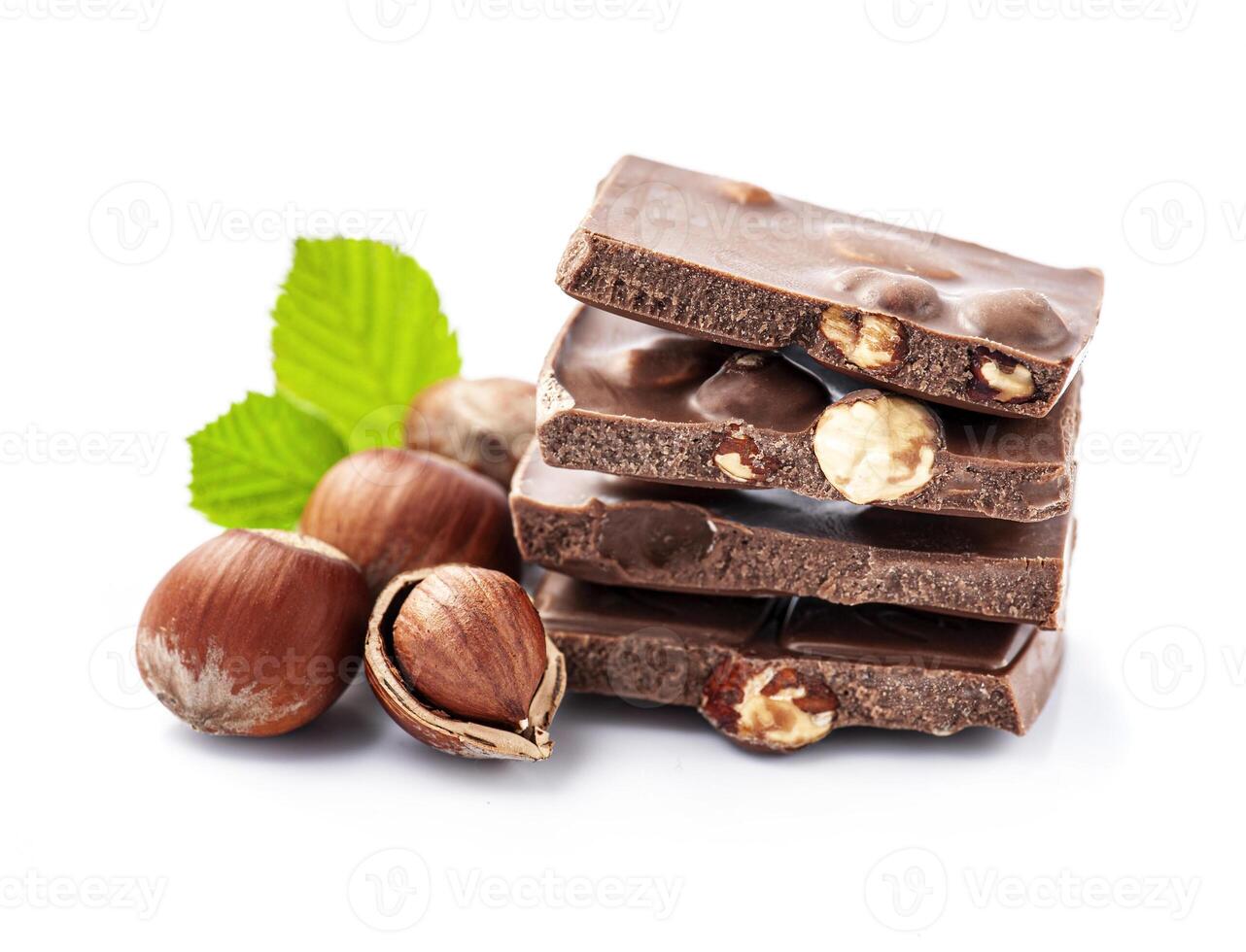 Chocolate with hazelnuts nuts on white backgrounds photo