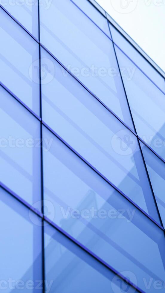 modern building exterior with geometric blue glass panels photo