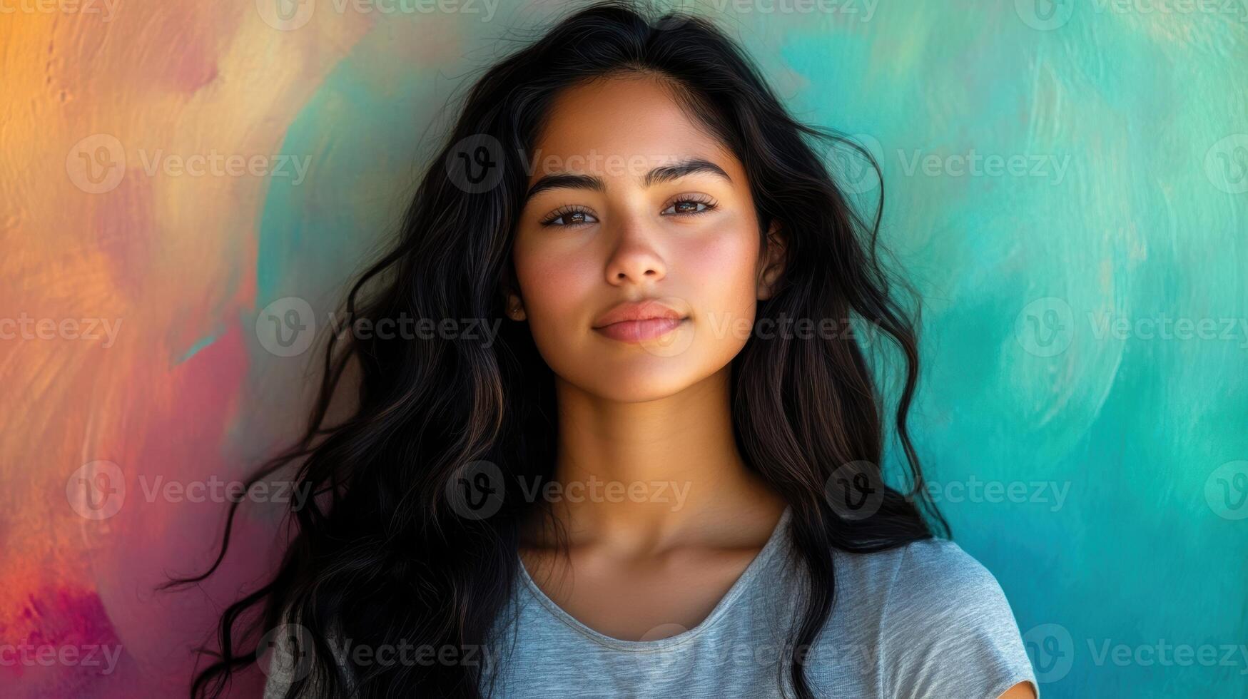 Close-up portrait of a young woman with wavy hair and a natural expression, surrounded by a soft, blurred background. photo