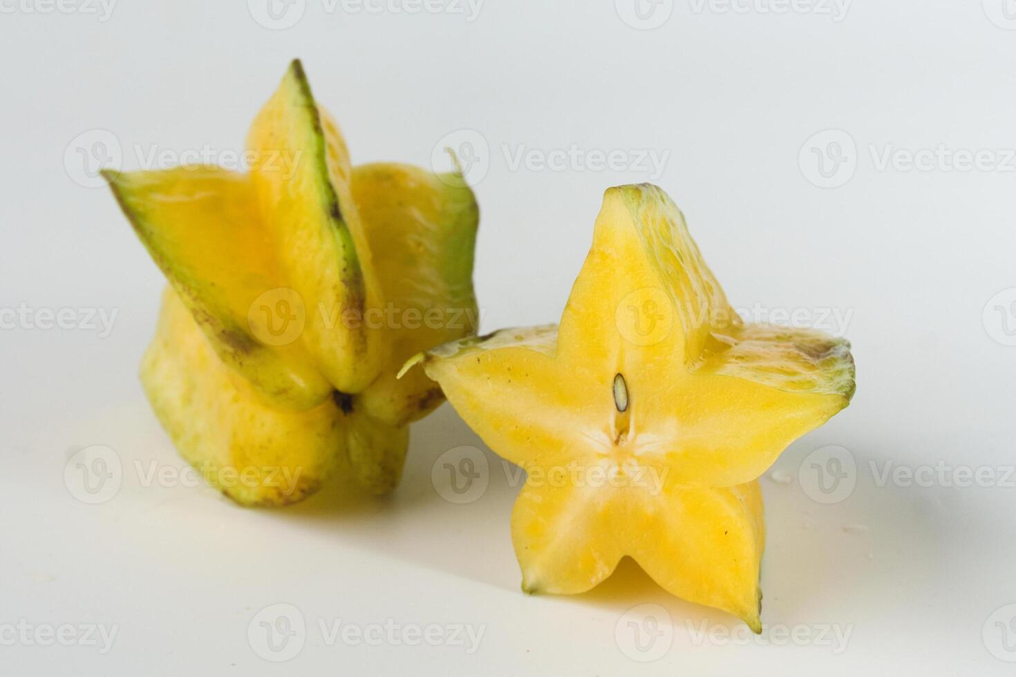 Close-Up of Ripe Yellow Starfruit on a White Background photo