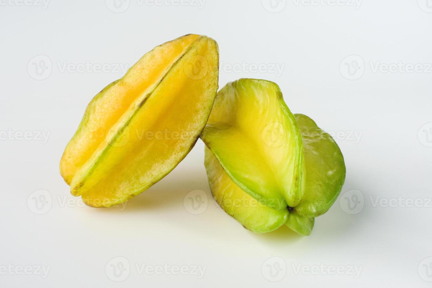 Fresh Yellow and Green Starfruit On a White Background photo