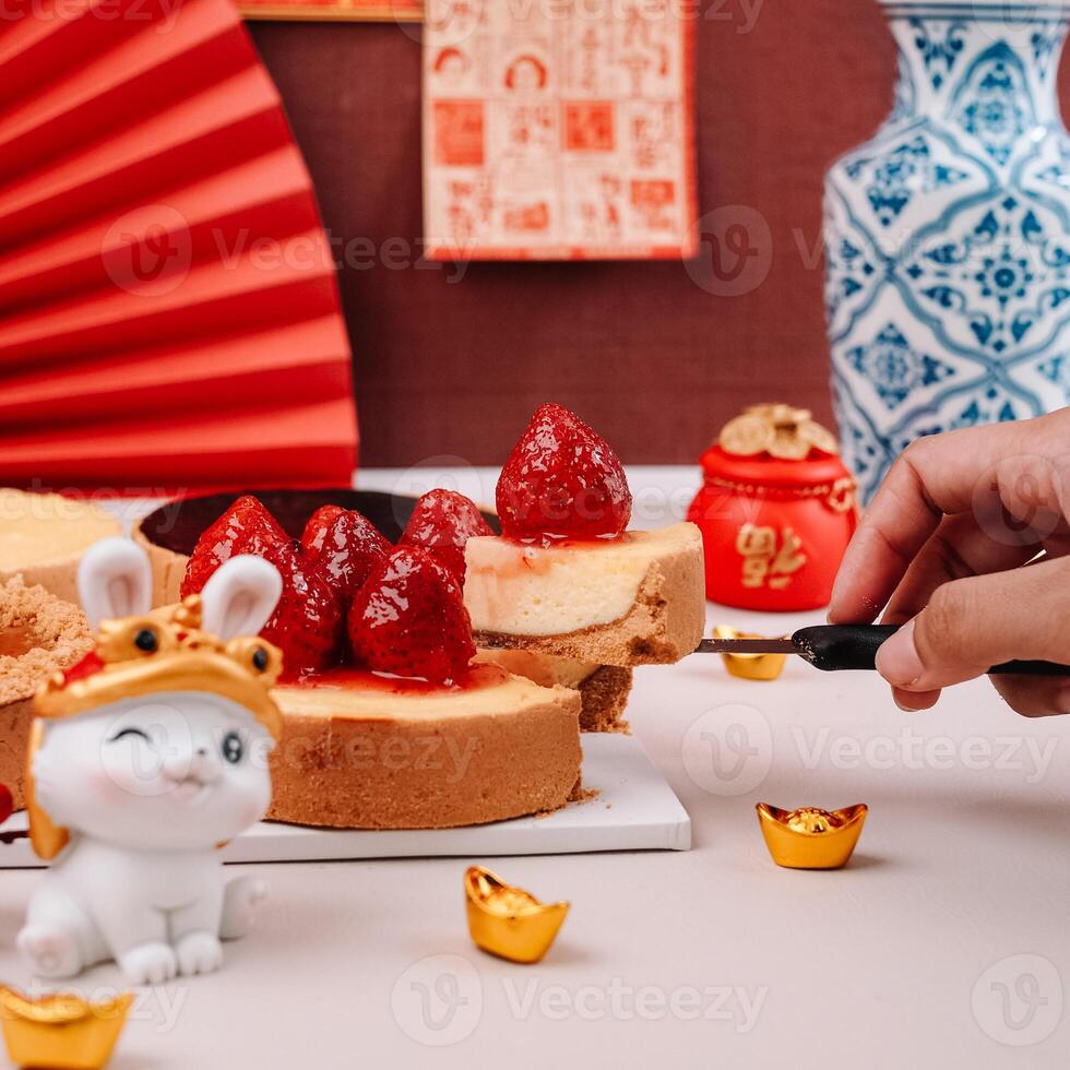 Ladies Hand Cut The Chinese New Years Chess Cakes with Chinese Ornaments Background photo
