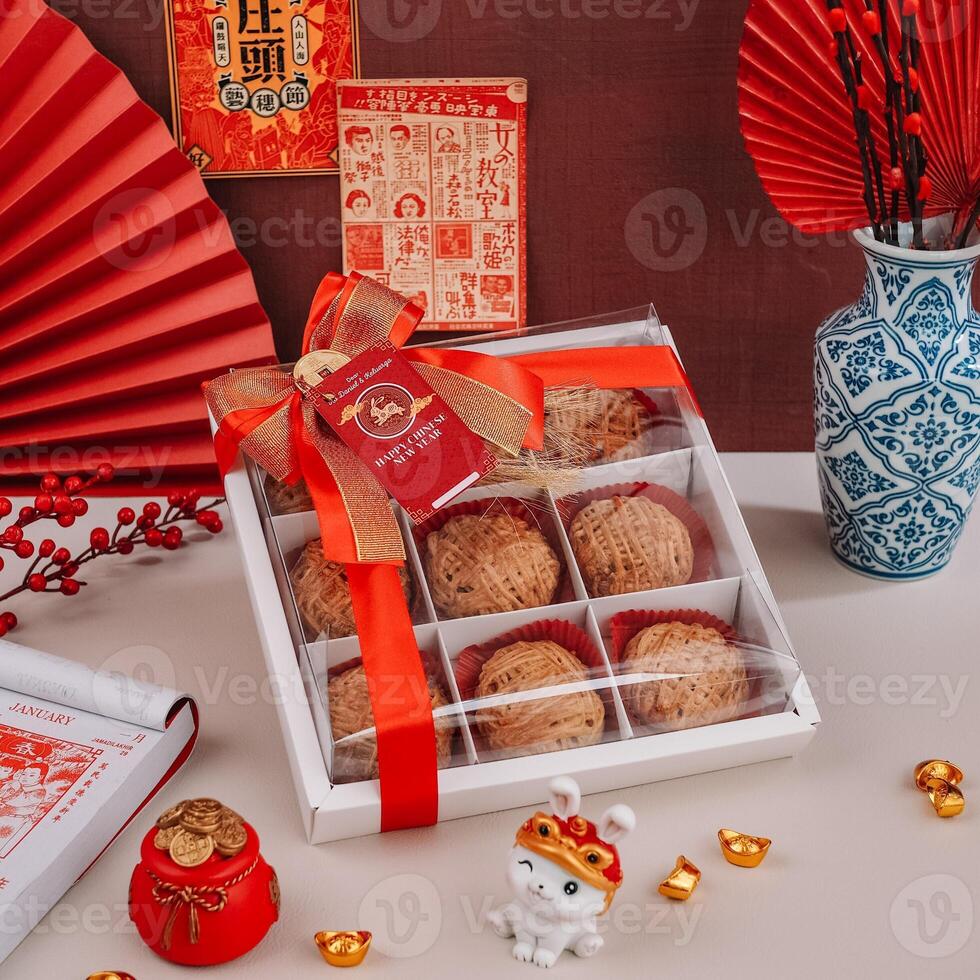 Chinese New Years Mini Pies with Chinese Posters and Ornaments Background photo