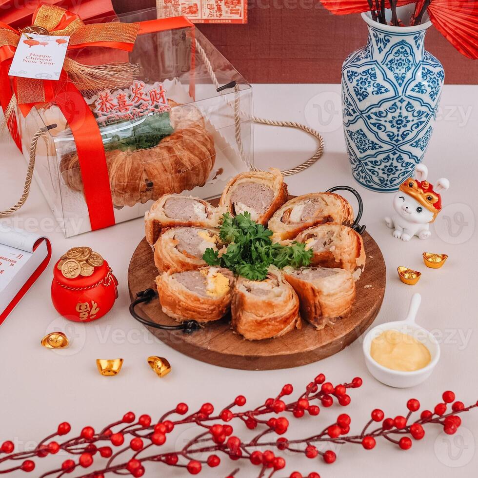 Chinese New Years Sliced Picnic Roll with Chinese Ornaments Background photo