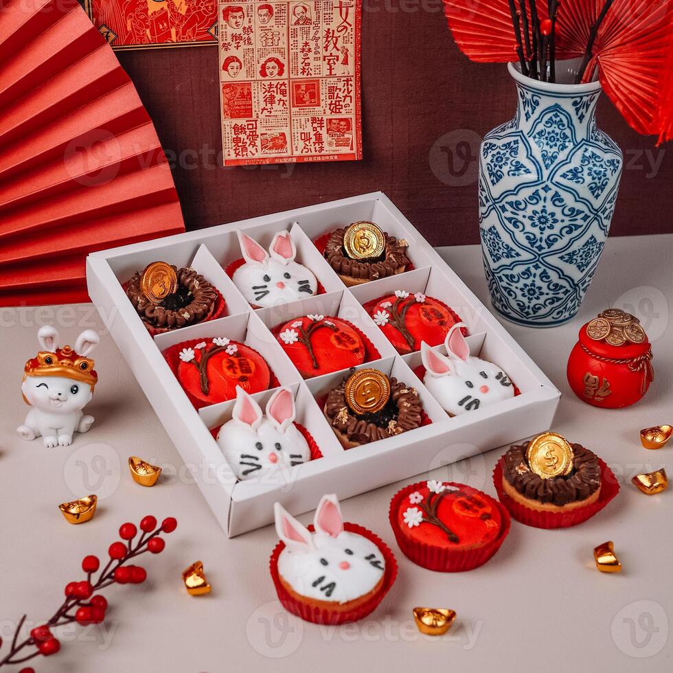 Chinese New Years Food with Rabbit Character and Chinese Ornaments Background photo