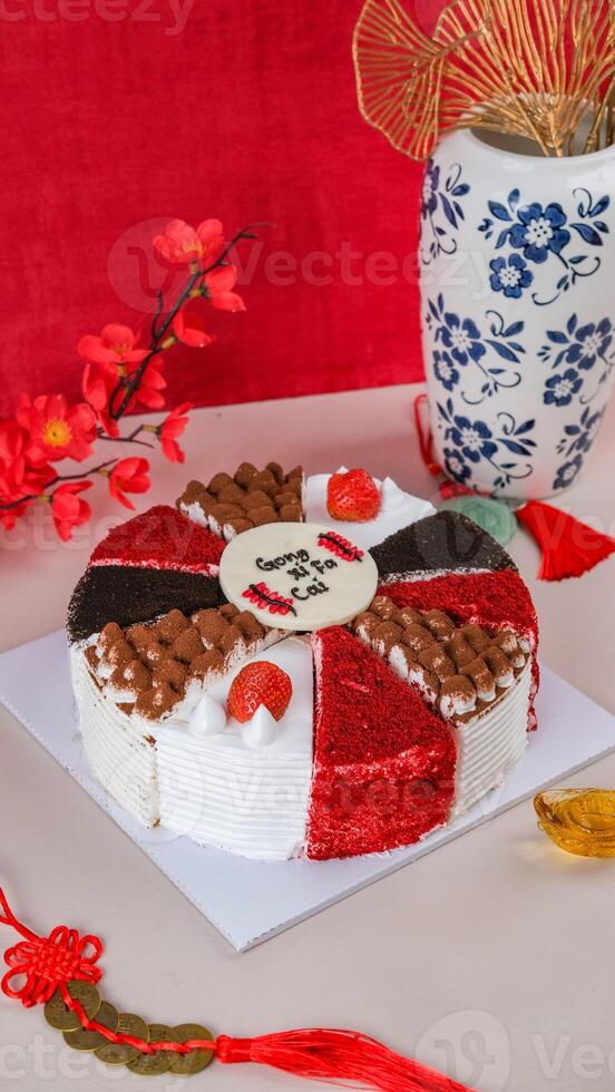 Special Chinese New Year Milecrepes with Chinese wording means Happy New Year, and Chinese Ornaments Background. photo