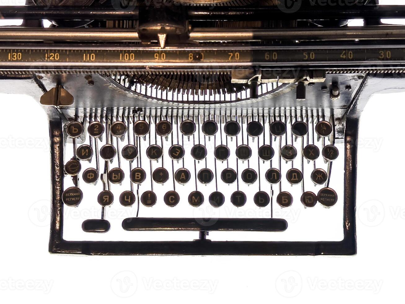A detailed view of a Soviet-era Leningrad typewriter with Cyrillic keys and elegant retro design. A historical artifact showcasing craftsmanship and utility from mid-20th-century Russia photo