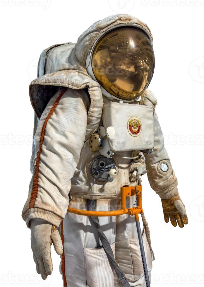 A detailed vintage Soviet-era space suit equipped with life support systems and a reflective visor. The suit features intricate details, including control mechanisms, a chest-mounted unit, and the photo