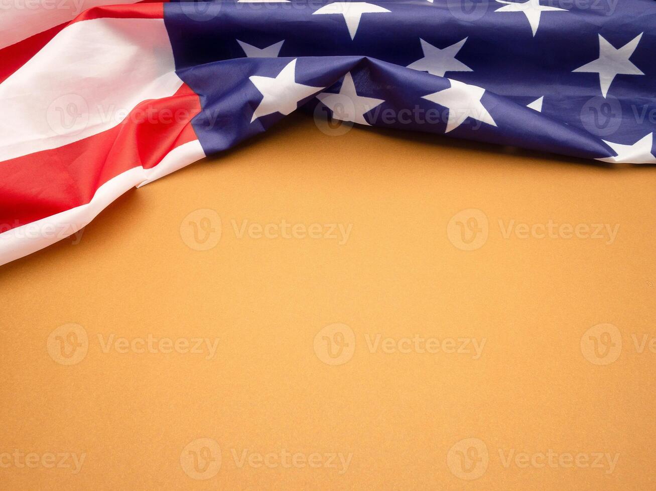 Top view of the American flag on a brown background photo