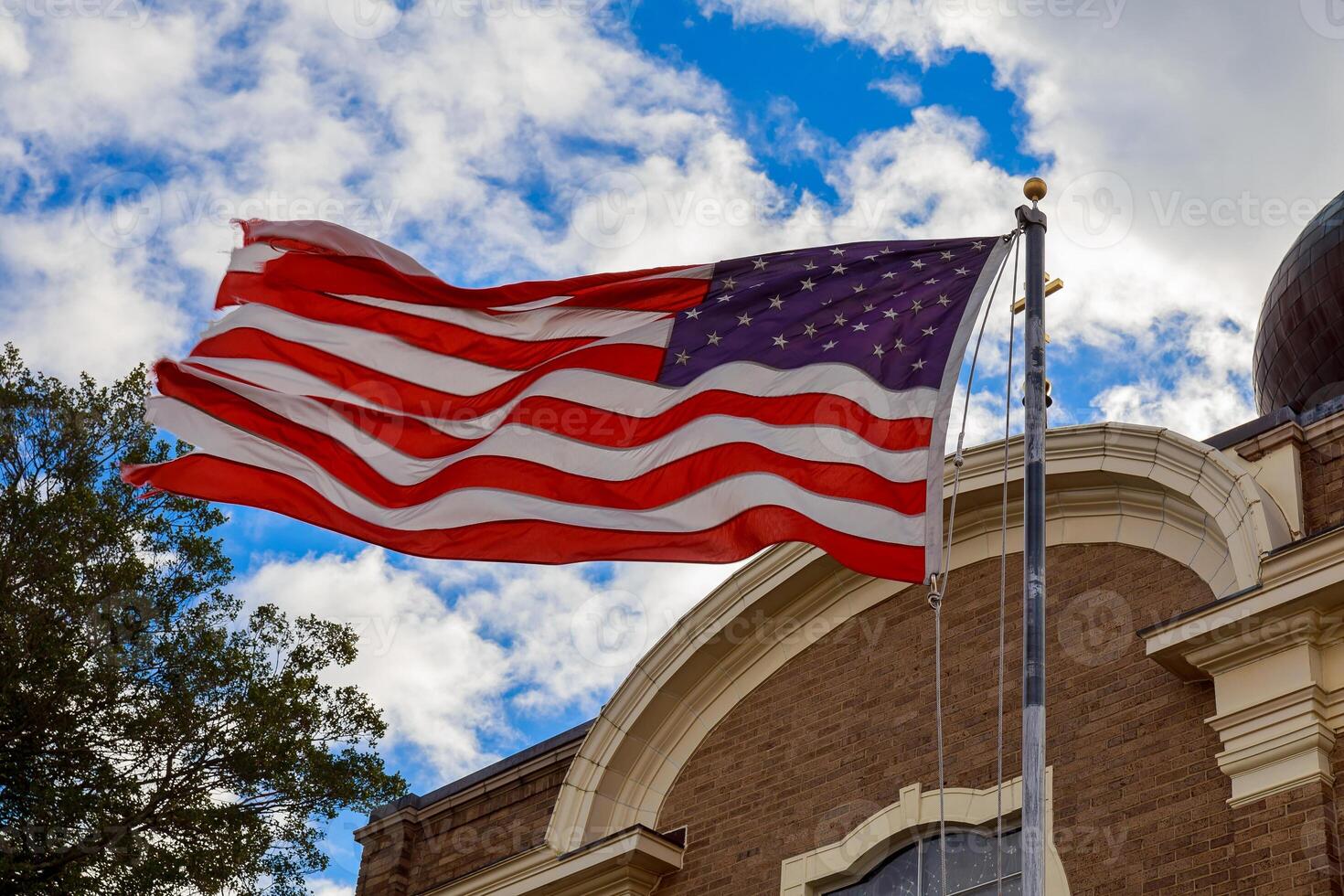 God Bless America American flag and old church steeple reflect separation of church and state photo