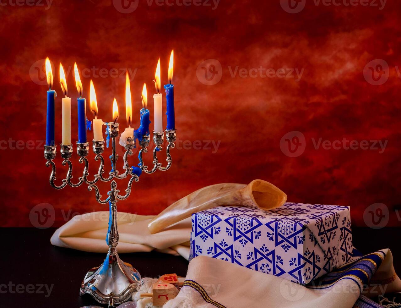 Jewish holiday Hanukkah creative background with menorah. View from above with focus on menorah. photo