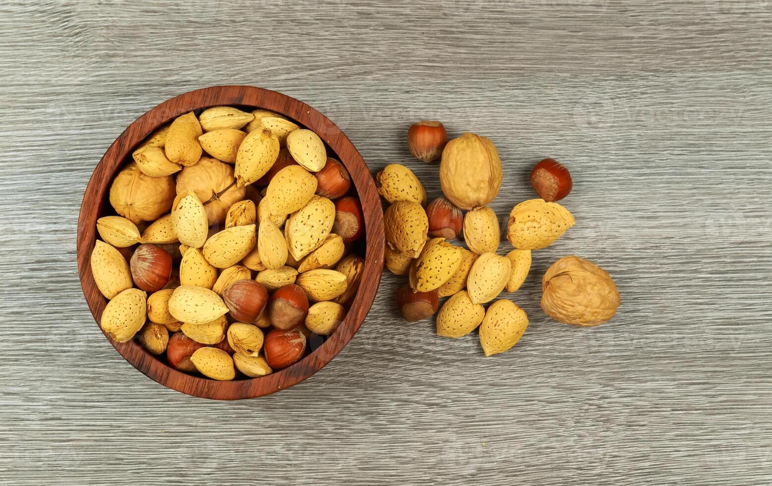 Assorted mixed nuts on white background almond hazelnut walnut photo