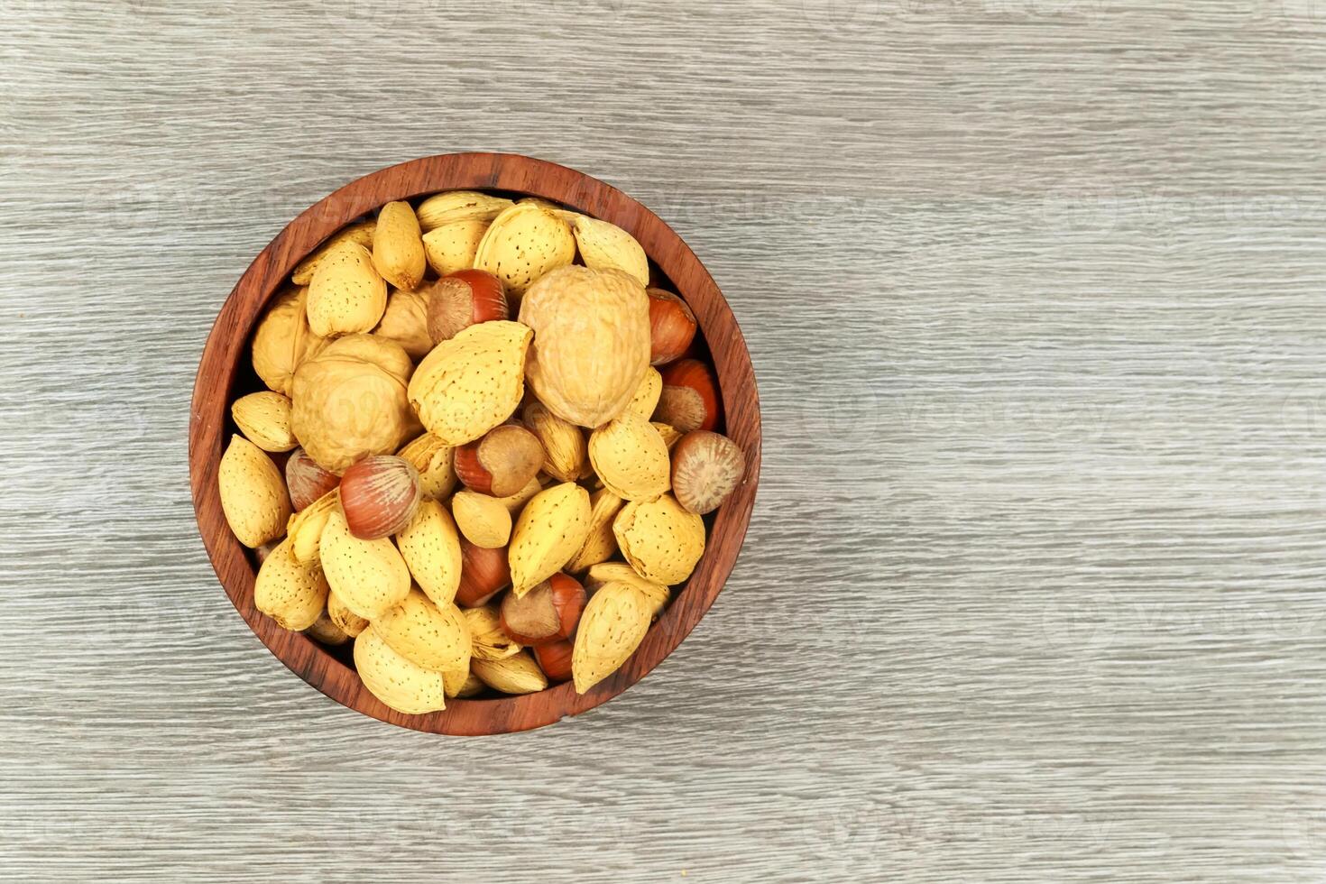 Assorted mixed nuts on white background almond hazelnut walnut photo