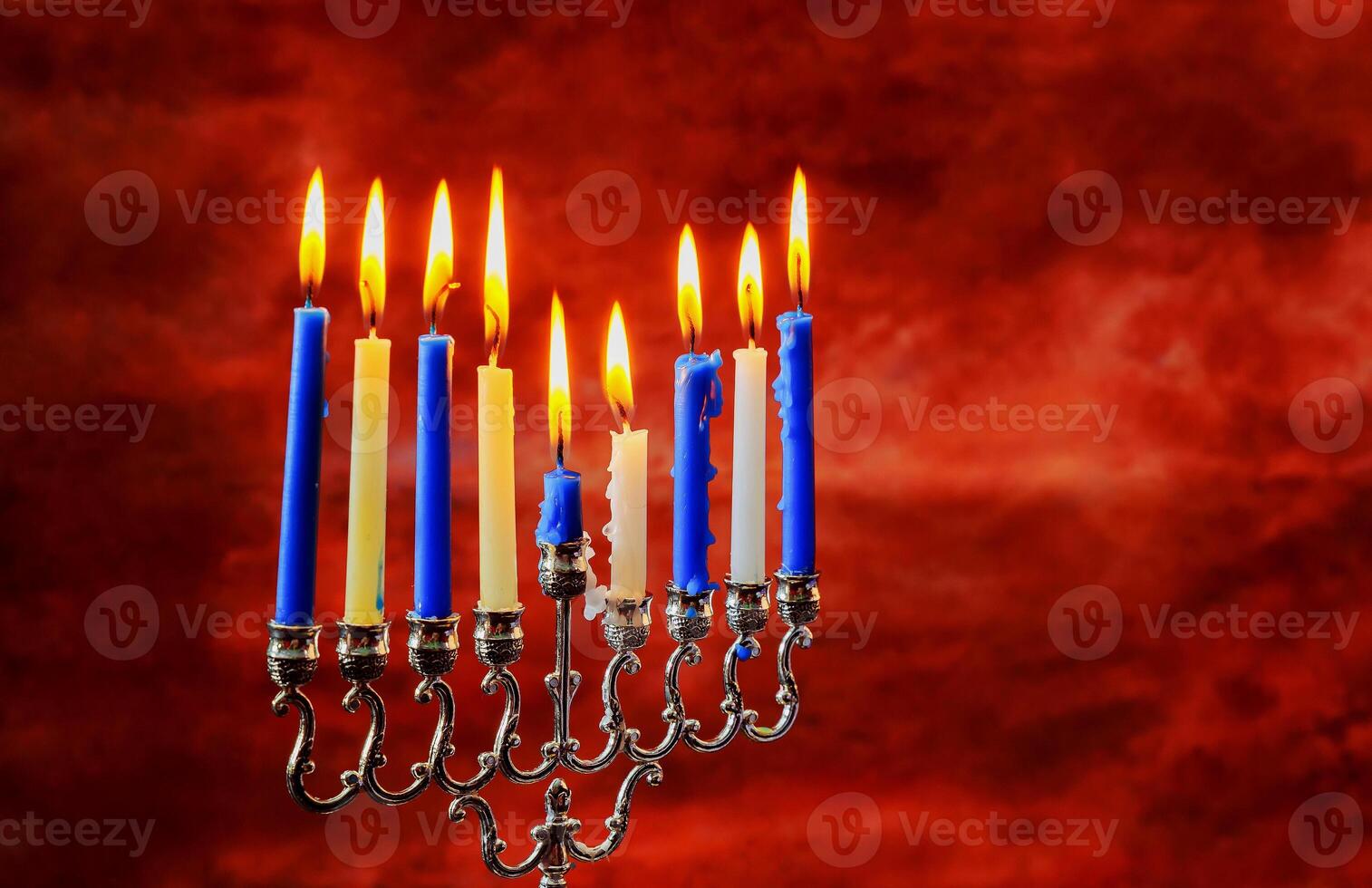 Jewish holiday Hanukkah creative background with menorah. View from above with focus on menorah. photo