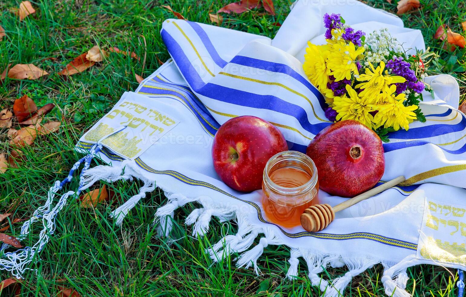 Jewish holiday Jewish new year. Rosh Hashana apples, honey and pomegranates on a dark wood background, traditional food for the Jewish new year. Rosh Hashana. selective focus on the middle of the honey photo