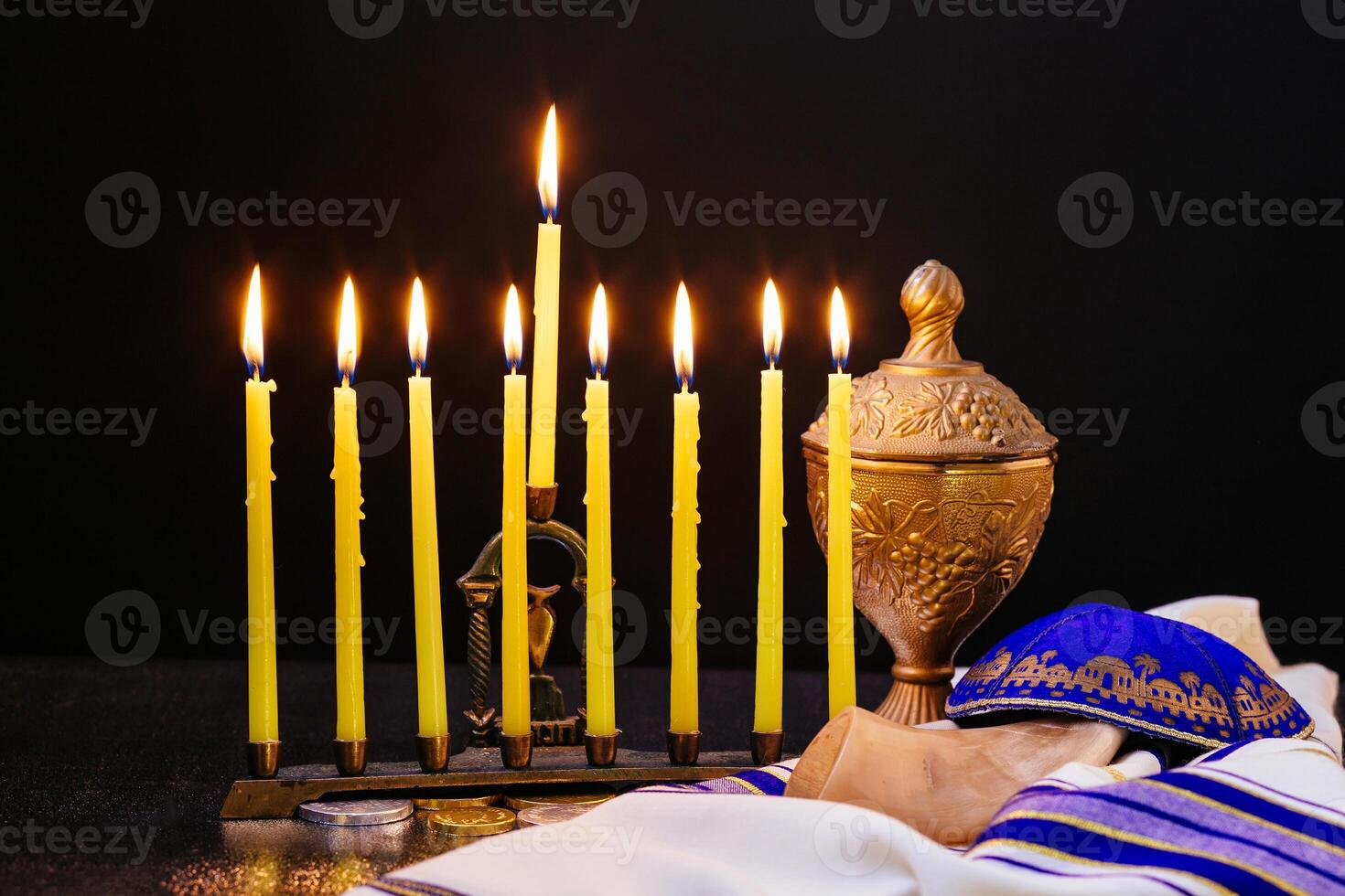 Jewish holiday hannukah low key image of jewish holiday Hanukkah with menorah traditional Candelabra and wooden dreidels spinning top . glitter overlay photo