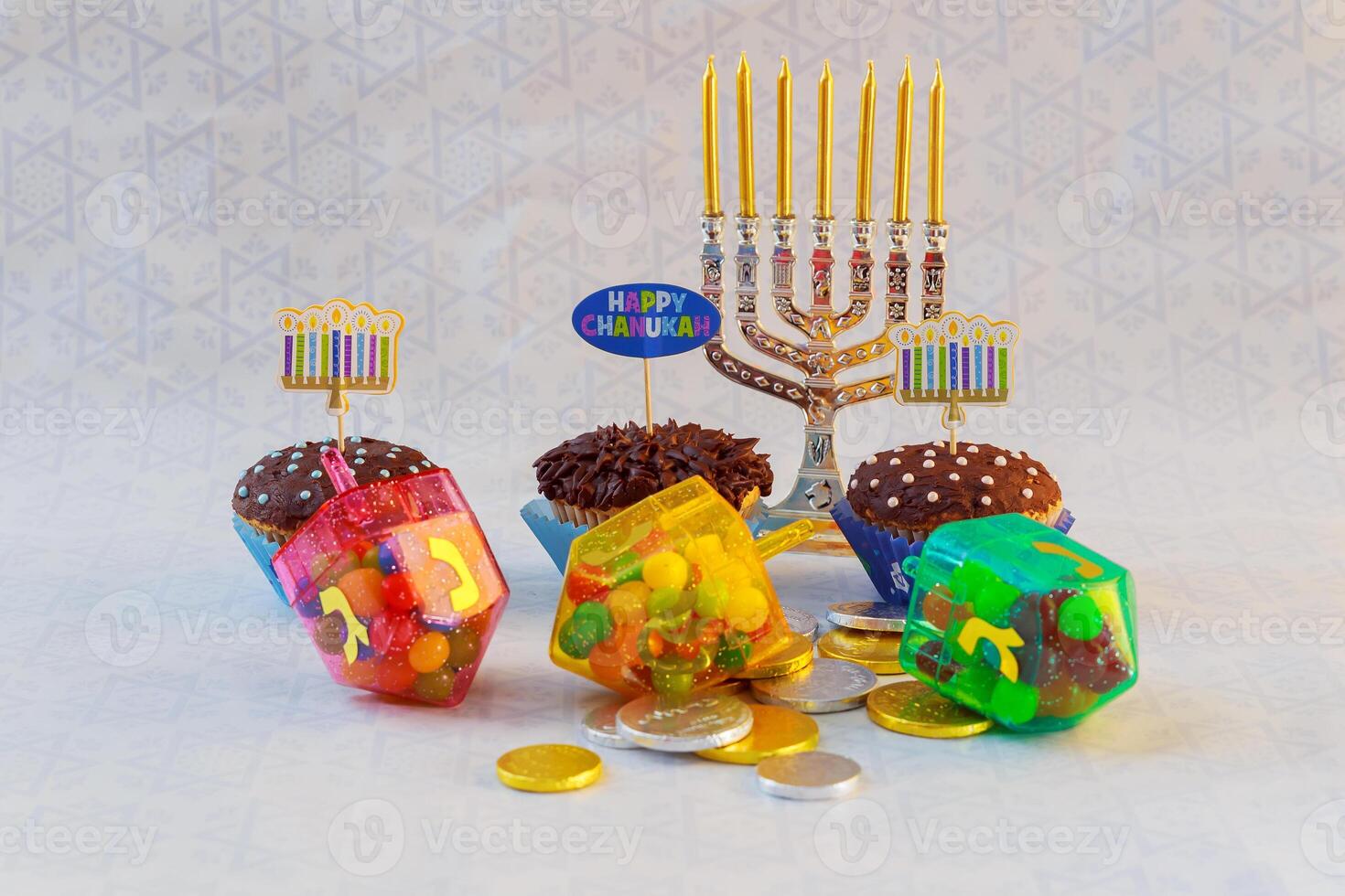 Jewish holiday Hanukkah cupcakes Gourmet cupcakes decorated with white and blue icing for Hanukkah. Jewish holiday A still life composed of elements of the Jewish Chanukah Hanukkah festival. photo