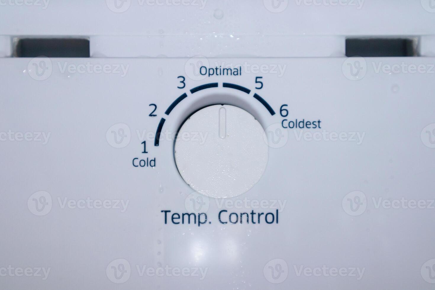 Refrigerator temperature control knob to adjust the level of coldness photo