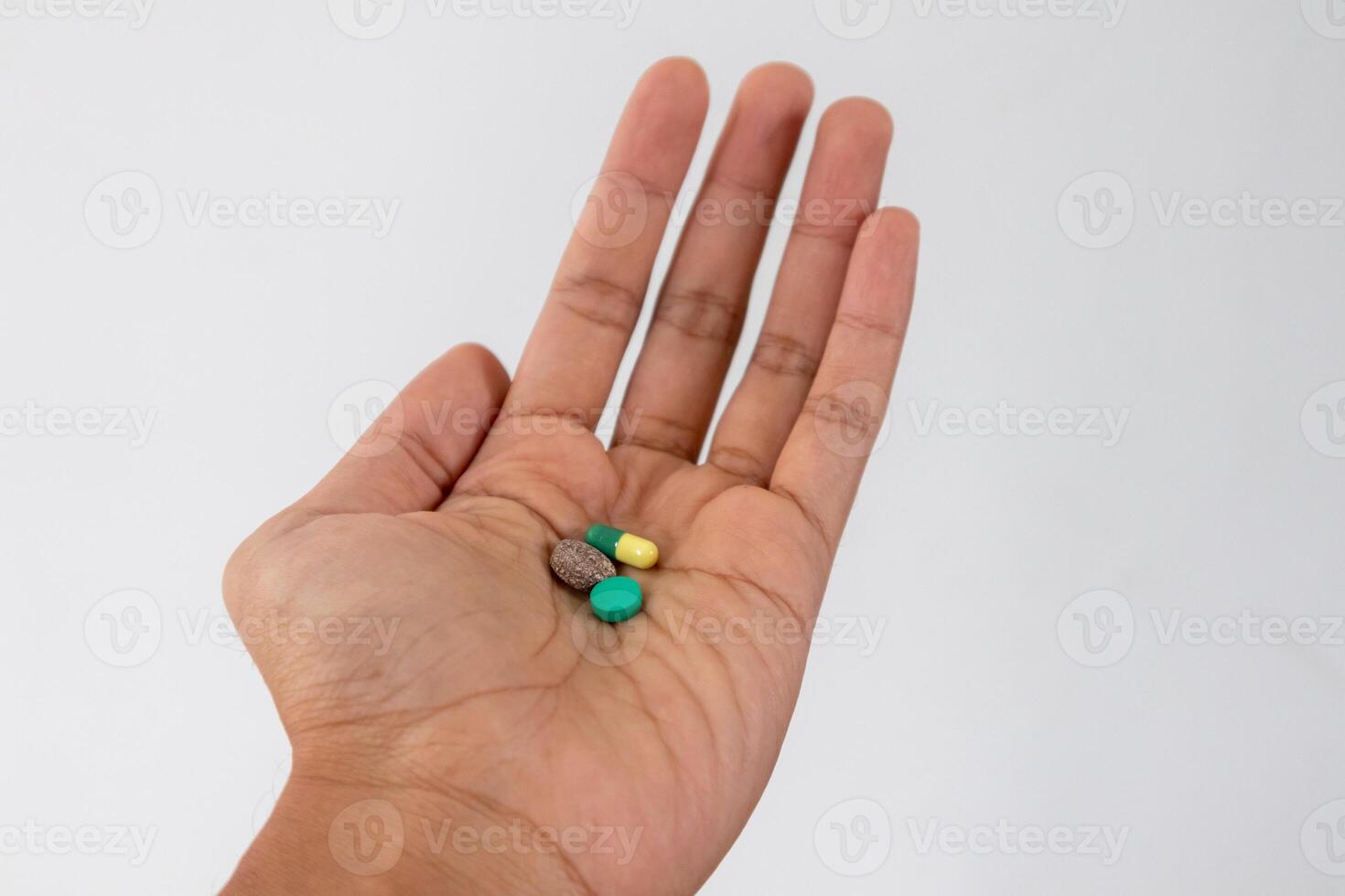 Three types of medicine in the palm of the hand photo