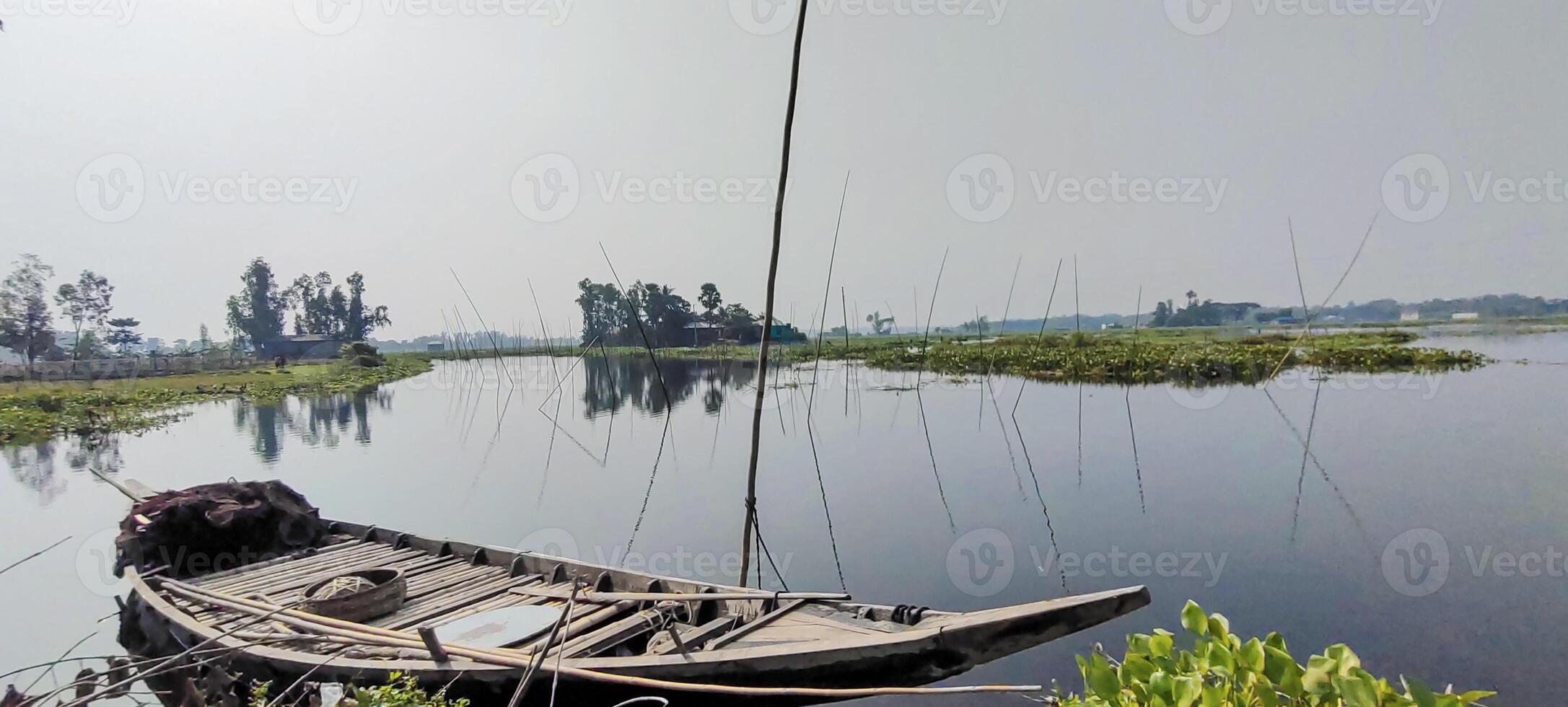 Serene River Landscape, boats on the lake, a boat is sitting on the shore of a river, Serene River Landscape photo