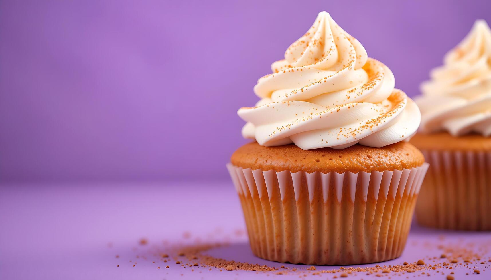 Cupcakes with Fluffy White Frosting and Vibrant Orange and Red Sprinkles, Artfully Displayed Against a Striking Purple Background photo
