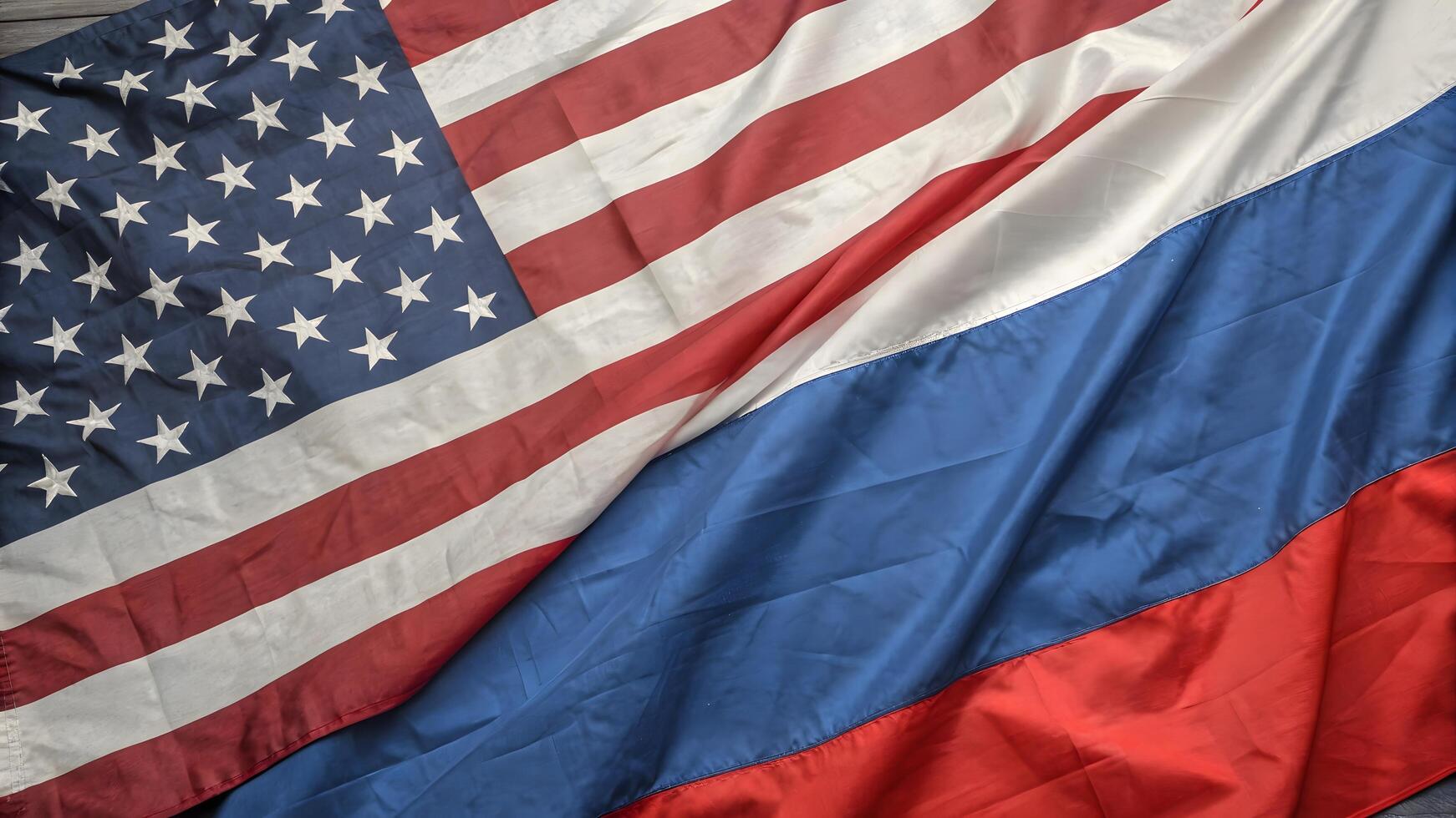 american and russian flags on wooden background photo