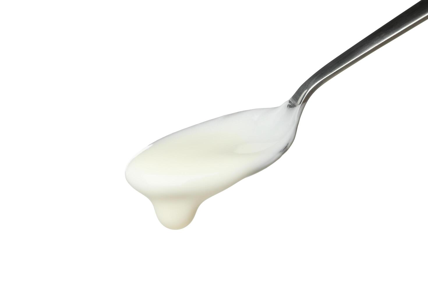 Spoon with sour cream yogurt isolated on white background photo