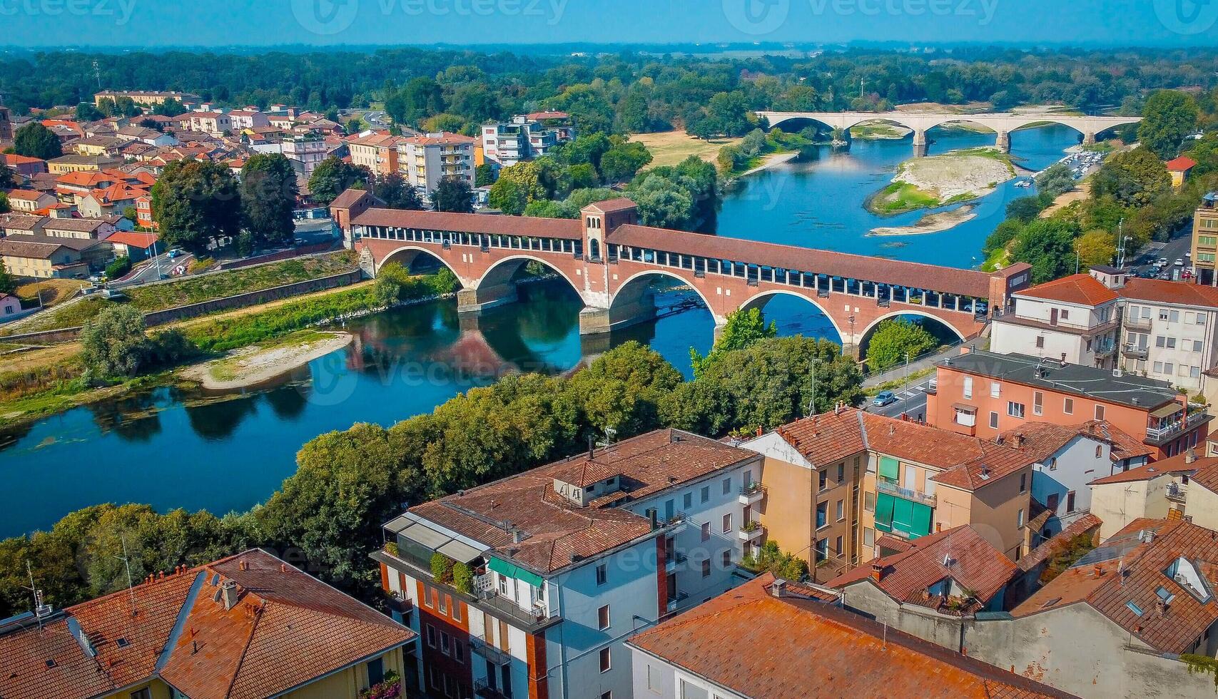 View of Ponte coperto, covered bridge, of Pavia, Italy. Bridge over the Ticino river in the city of Pavia in Lombardy. photo