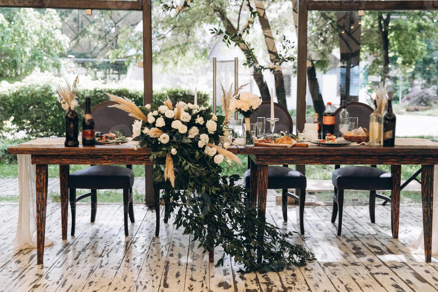 Wedding table of newlyweds with decorations and flowers, without people photo