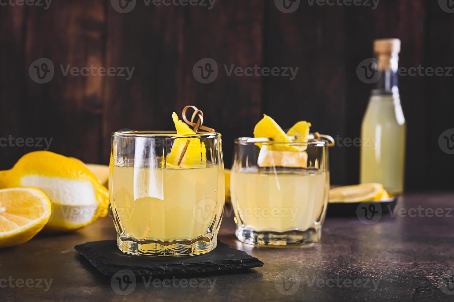 Traditional homemade limoncello in glasses on the table photo