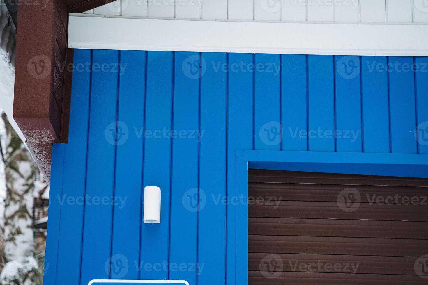 There is a striking blue building prominently displaying a sign indicating that no parking is allowed in the vicinity of the structure, ensuring a clear message for visitors photo