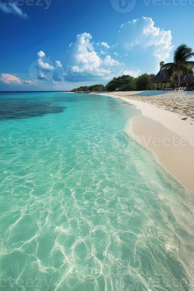 A beautiful beach with clear blue water and white sand. The sky is cloudy, but the water is still calm. The beach is empty, and there are no people in the scene photo