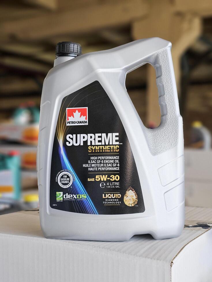 Russia, Saint Petersburg, September 25, 2023 4 liter plastic canister with Supreme synthetic 5W30 engine oil photo
