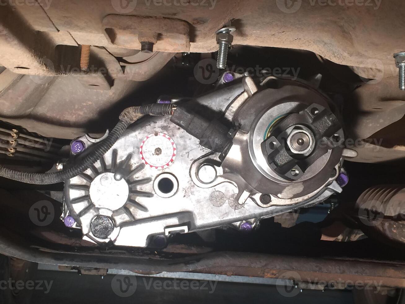 Transfer Case on a 1990s SUV with Purple Painted Accent Bolts photo
