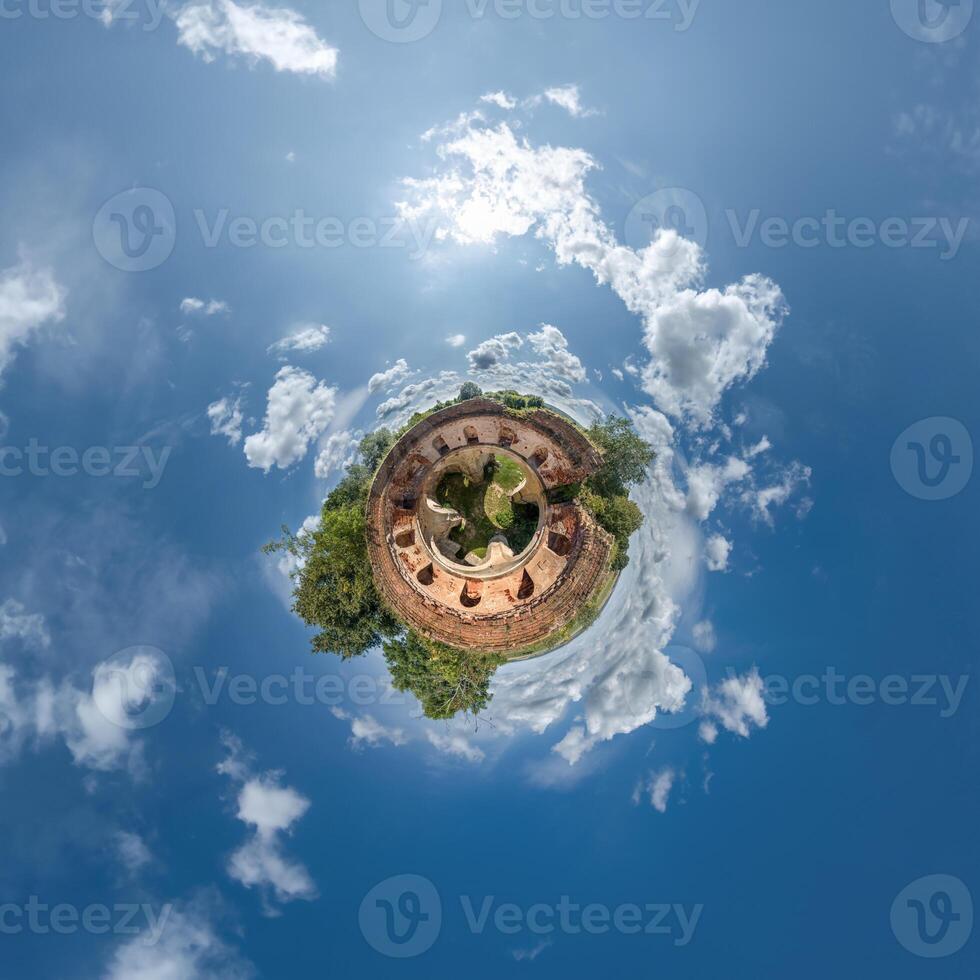 A small planet with a building in the middle photo