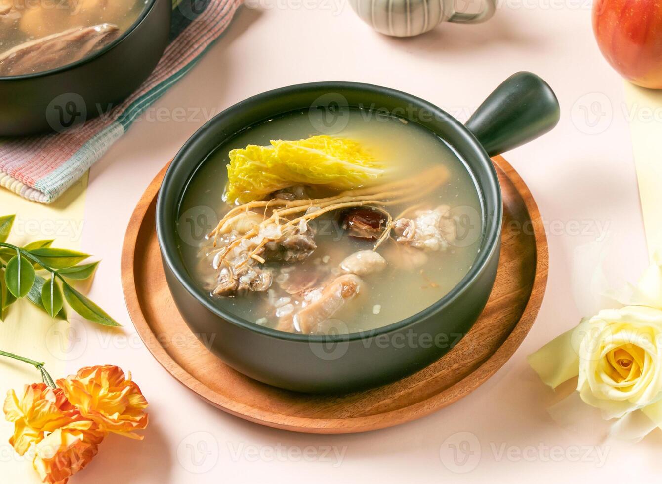 Ginseng Glutinous Rice Chicken Soup served in bowl on wooden tray side view of taiwan hot soup photo