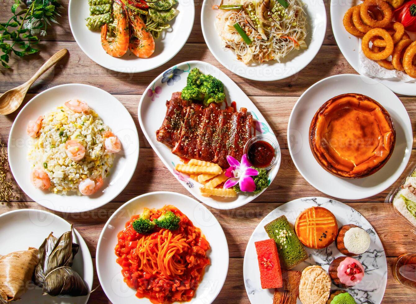 Grilled Pork Ribs, Steamed Zongzi, Shrimp pesto pasta, shrimp fried rice, Meat Spaghetti with tomato sauce, Fried Rice Noodles, shredded pork, crispy onion rings, french pastries, top view food photo