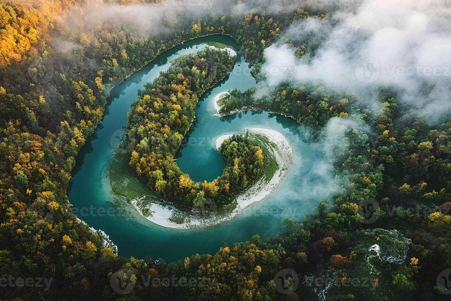 A breathtaking aerial view of a river winding through a vibrant autumn forest, showcasing the rich colors of fall foliage and the beauty of nature's seasonal transformation photo
