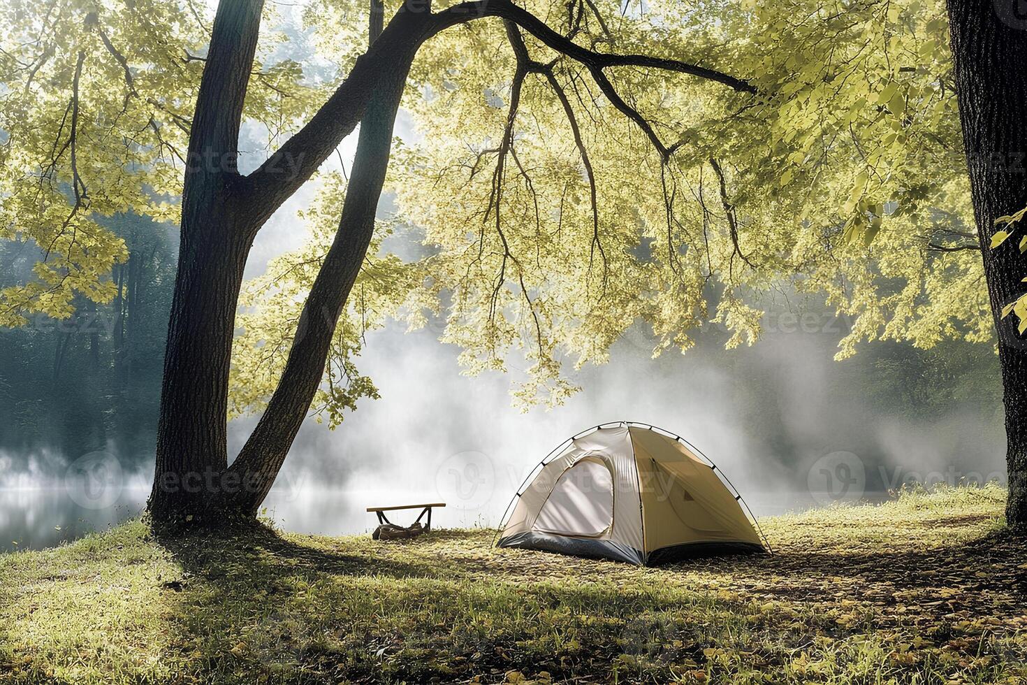 A camping tent set up by the lake shore in an autumn forest, surrounded by morning fog, creating an atmosphere of solitude and tranquility. Perfect for imagery about camping, autumn photo