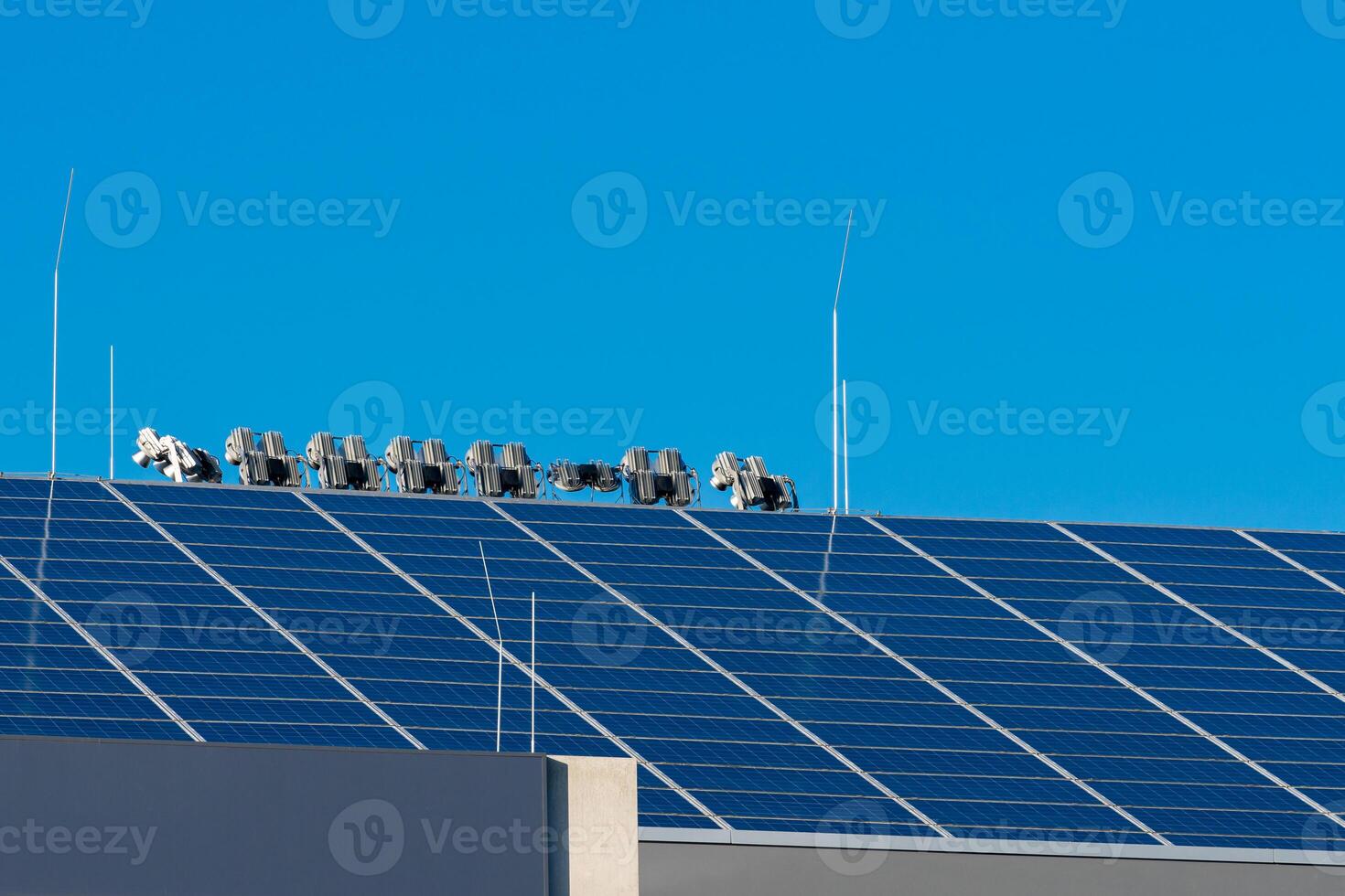 Solar panels harnessing sunlight on a rooftop in clear weather photo