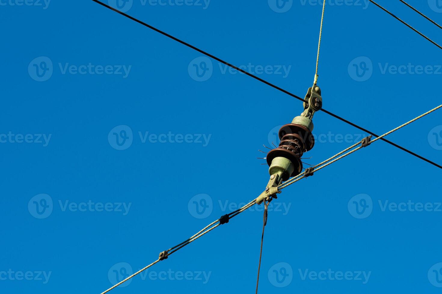 A close-up view of electrical power lines featuring a connector photo