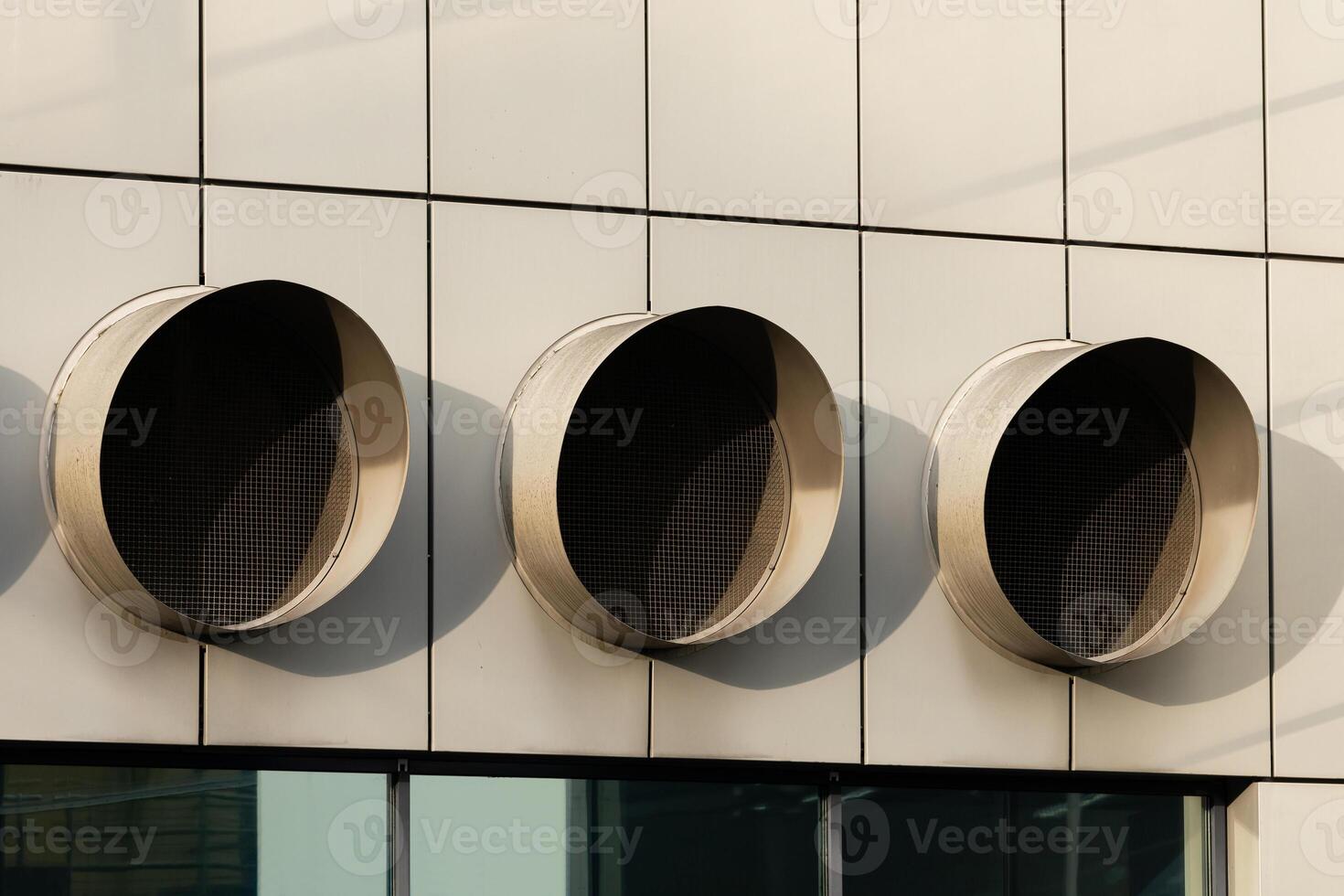Modern ventilation system design on building facade photo