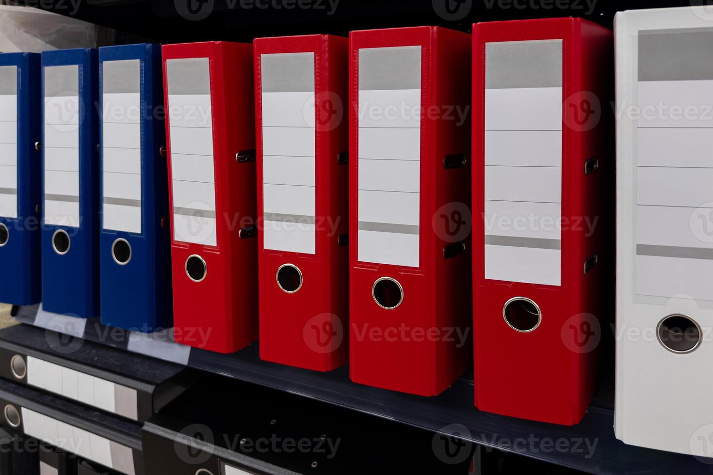 Office organization with colorful file folders on a shelf photo
