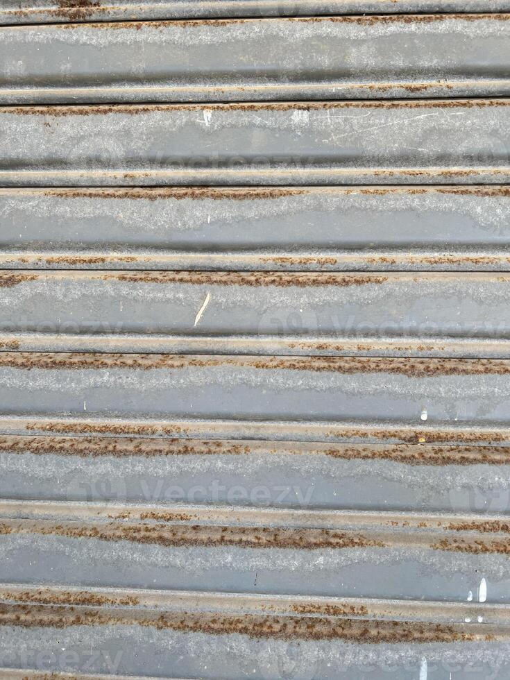 metal texture with scratches and cracks which can be used as a background photo