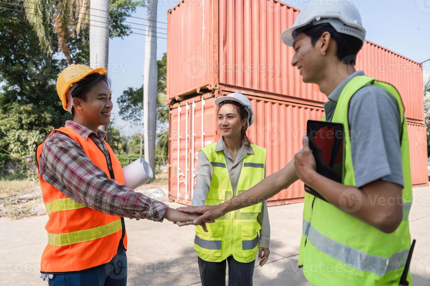 Logistics engineering team sealing agreements with a handshake at a construction site photo