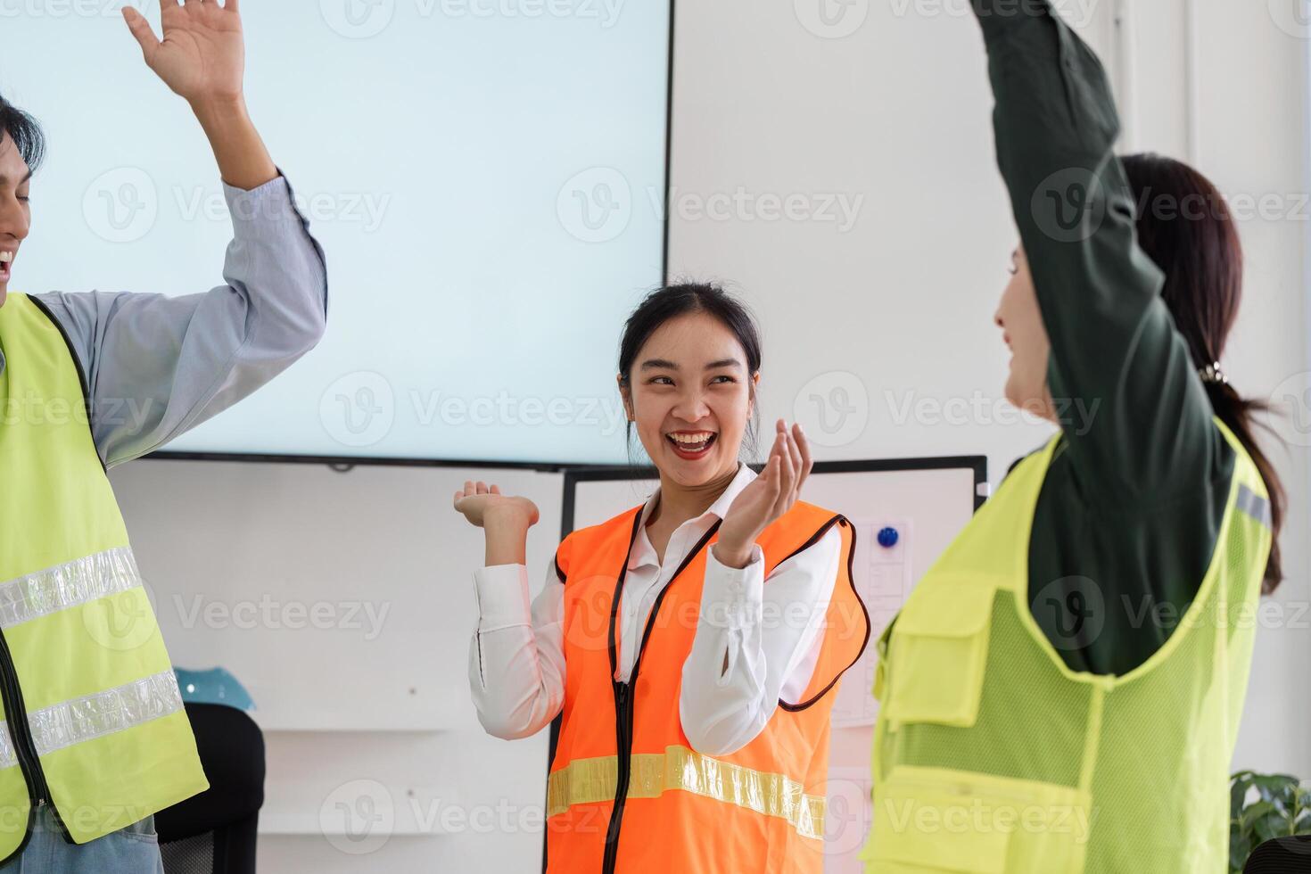 Celebratory construction team expressing excitement after a successful project discussion photo